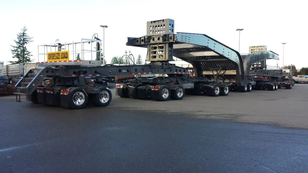 Side view of oversized multi-axle black trailer