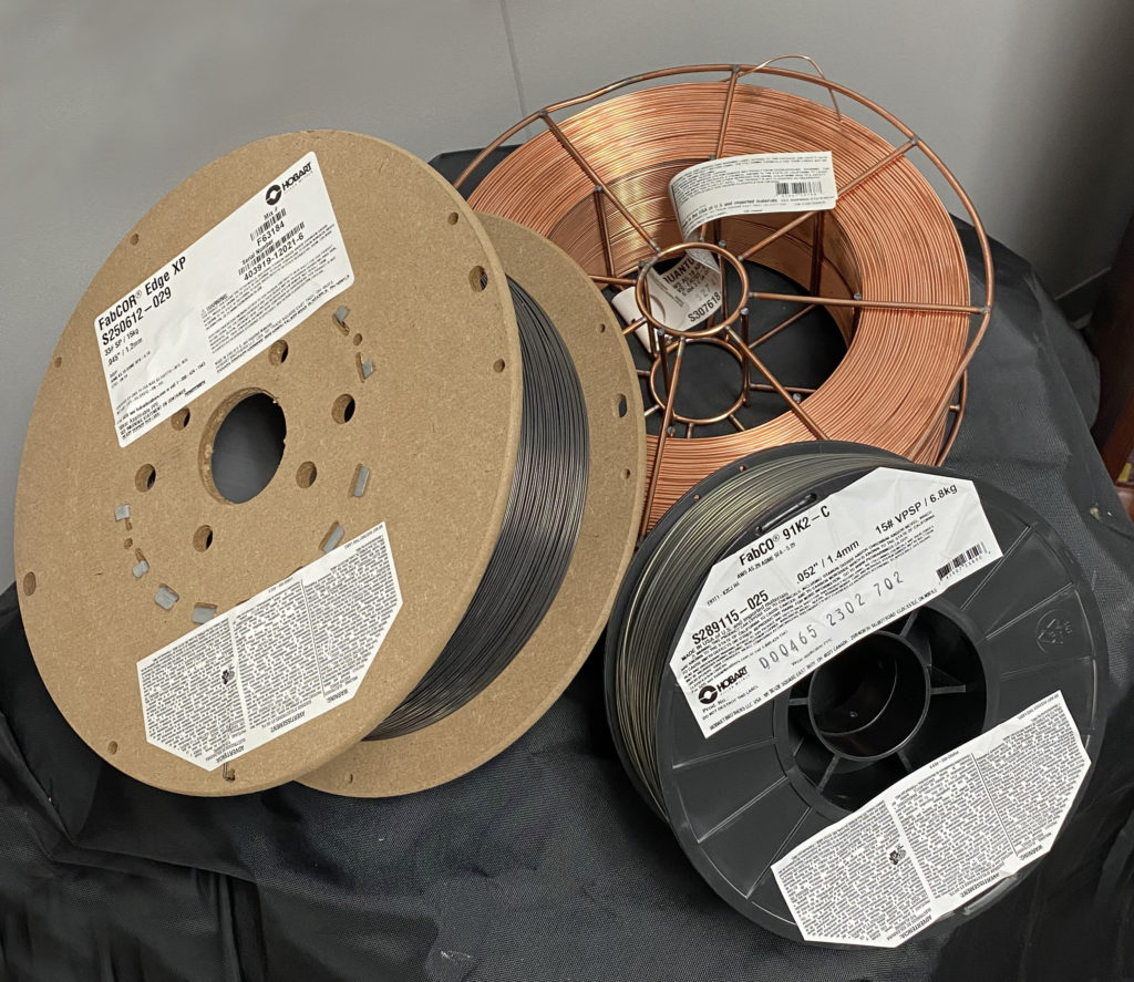 Product photo of fiberboard, steel, plastic welding wire spools