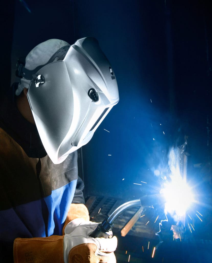 Side view of welder welding out-of-position on a part