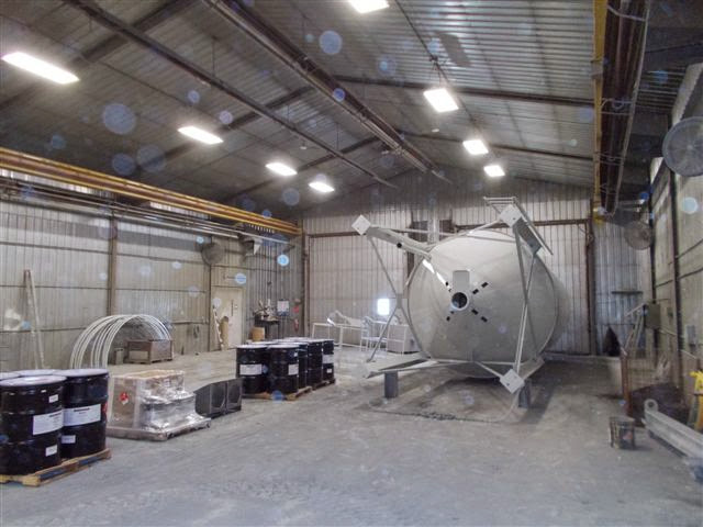 White tank for holding concrete in paint room